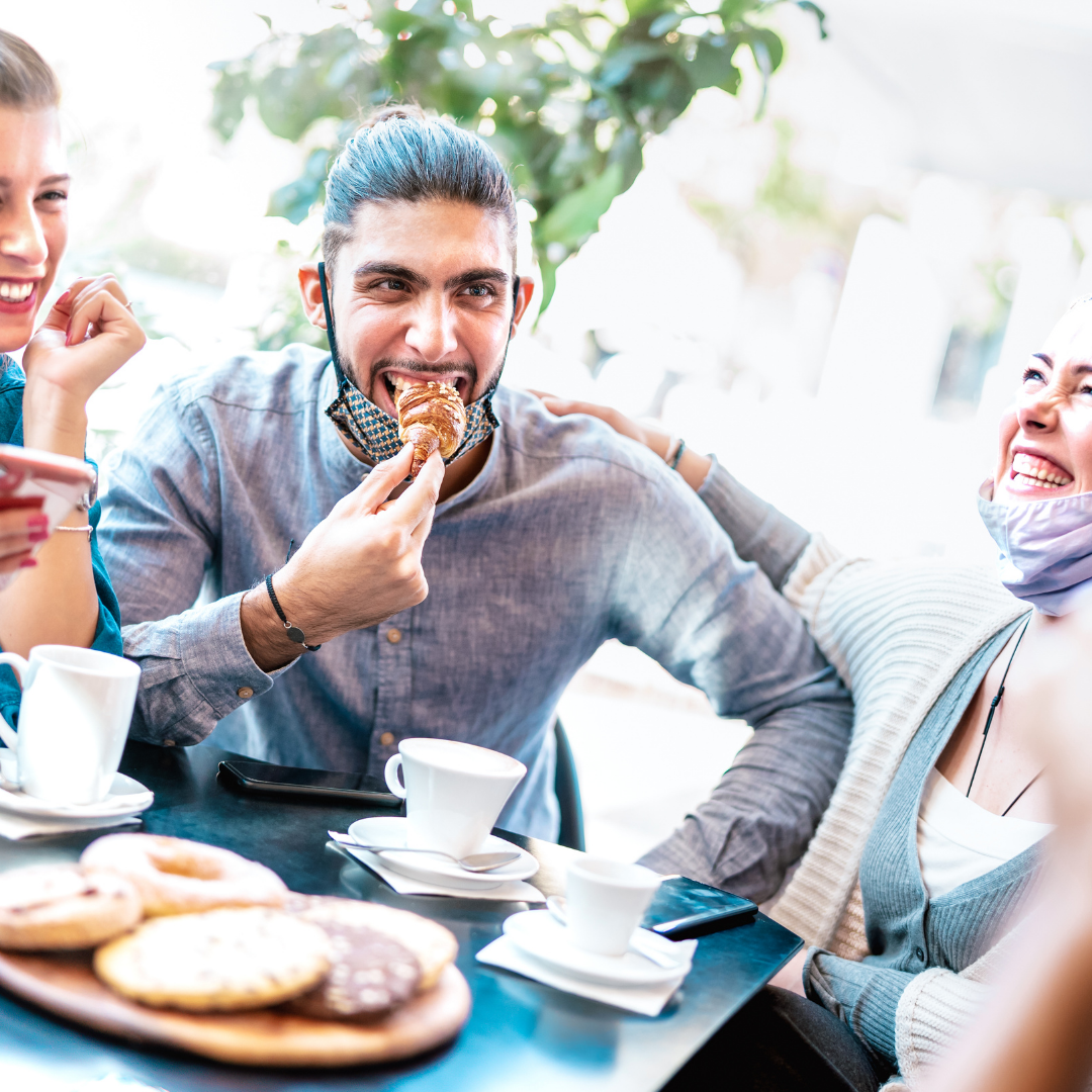Photo of people eating outdoors